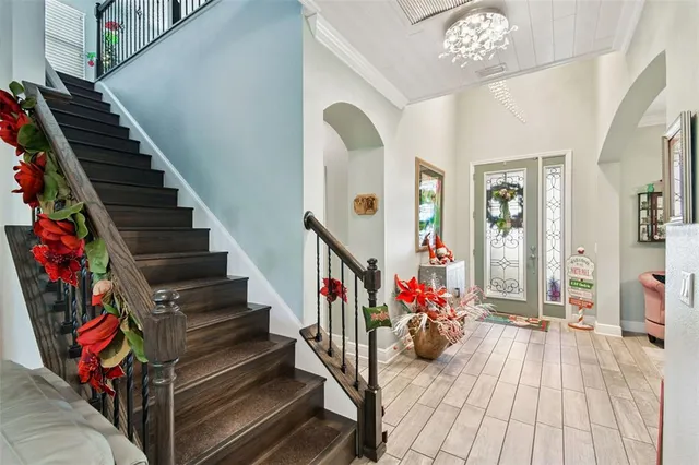 a view of entryway with wooden floor and stairs