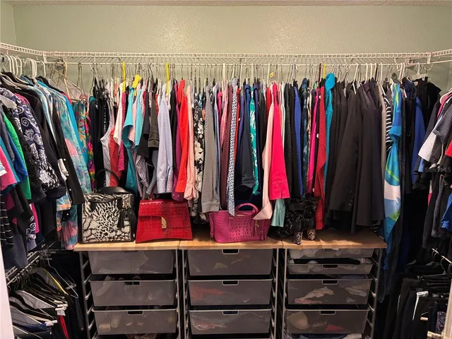 a bedroom with a bed dresser and a window