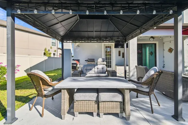 a front view of a house with a garden and plants