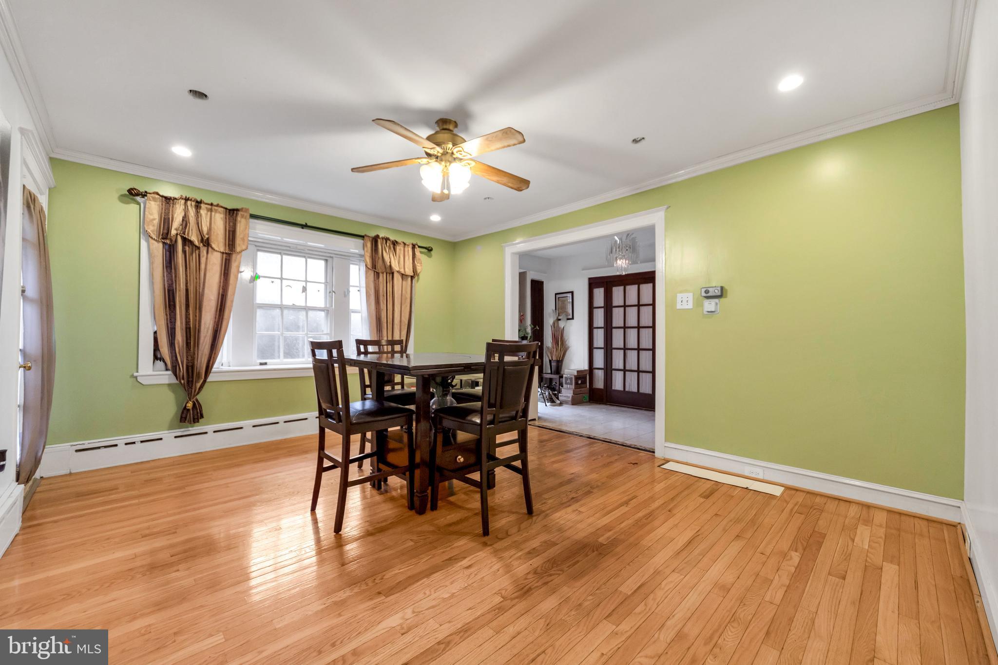 817 Ashbourne Road Cheltenham, PA 19012 - Photo 12 of 38 a view of a dining room with furniture and wooden floor
