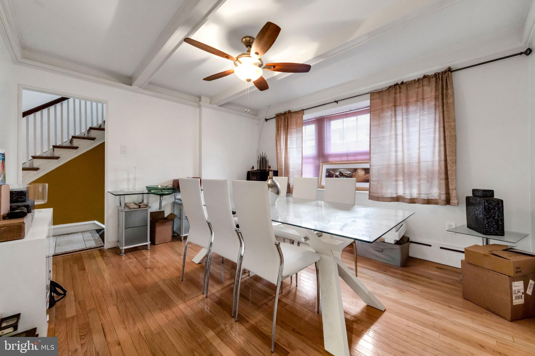 817 Ashbourne Road Cheltenham, PA 19012 - Photo 14 of 38 a view of a dining room with furniture window and wooden floor