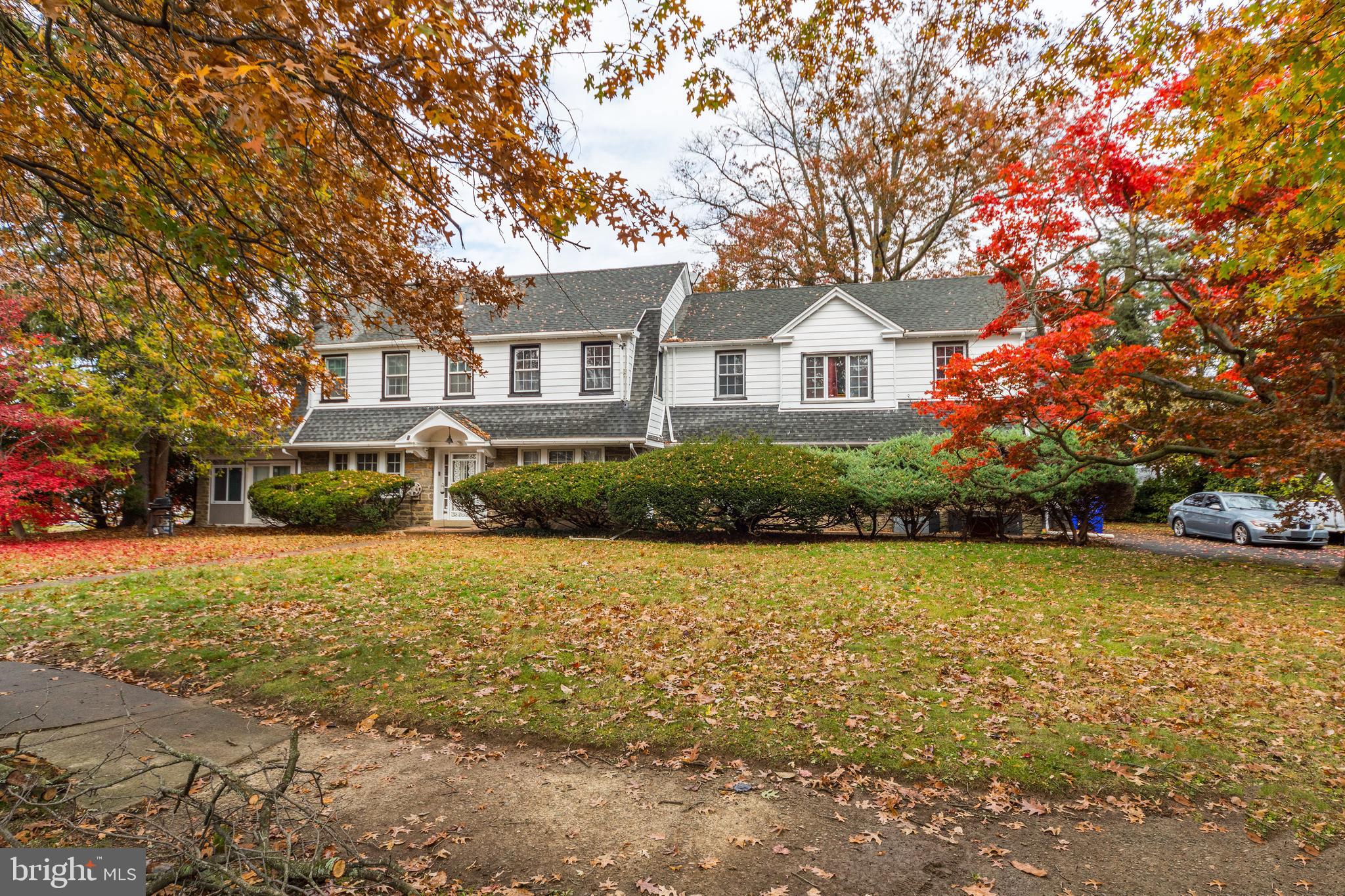 817 Ashbourne Road Cheltenham, PA 19012 - Photo 2 of 38 a front view of a house with a garden