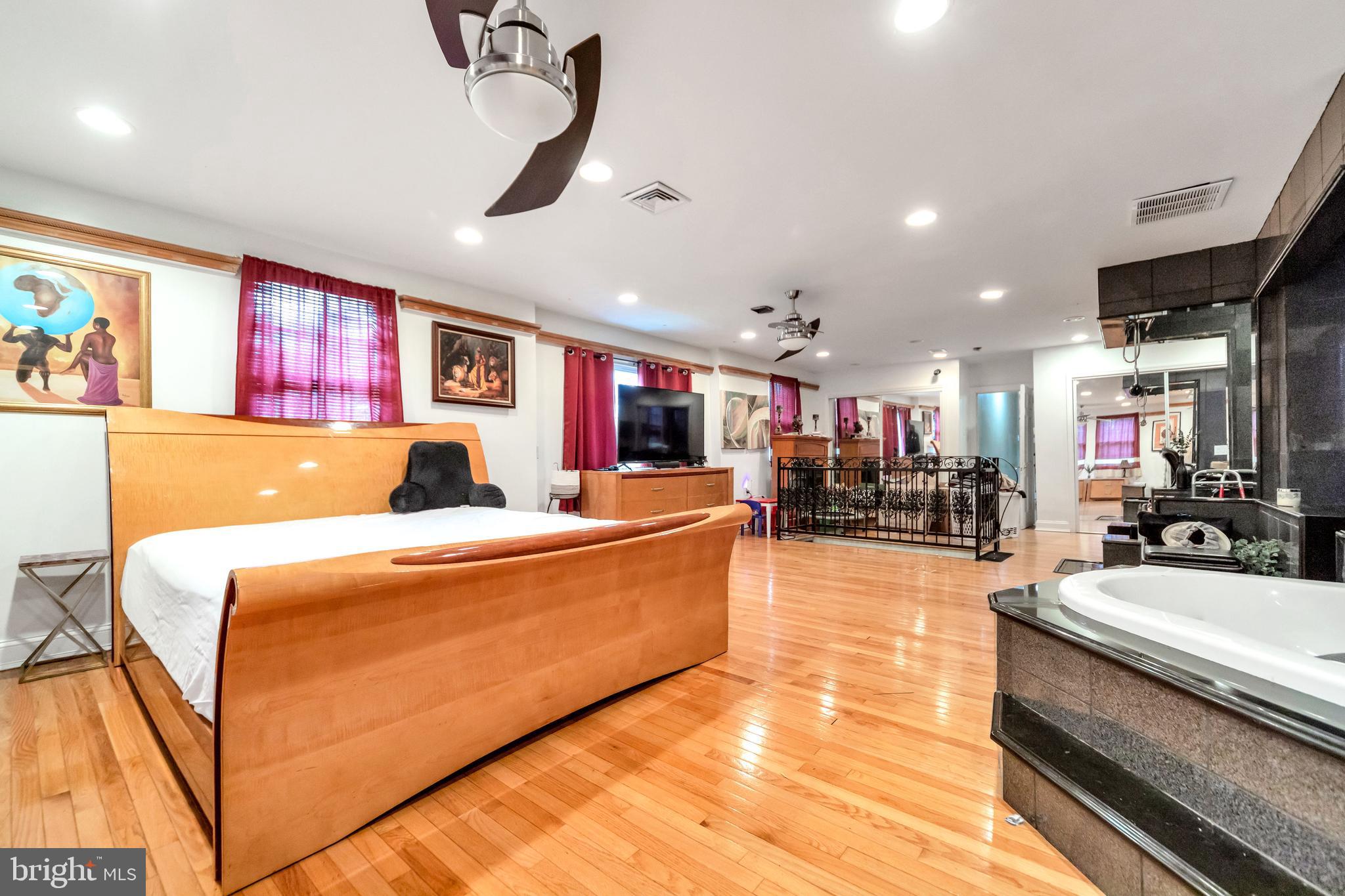 817 Ashbourne Road Cheltenham, PA 19012 - Photo 22 of 38 a living room with furniture and a flat screen tv