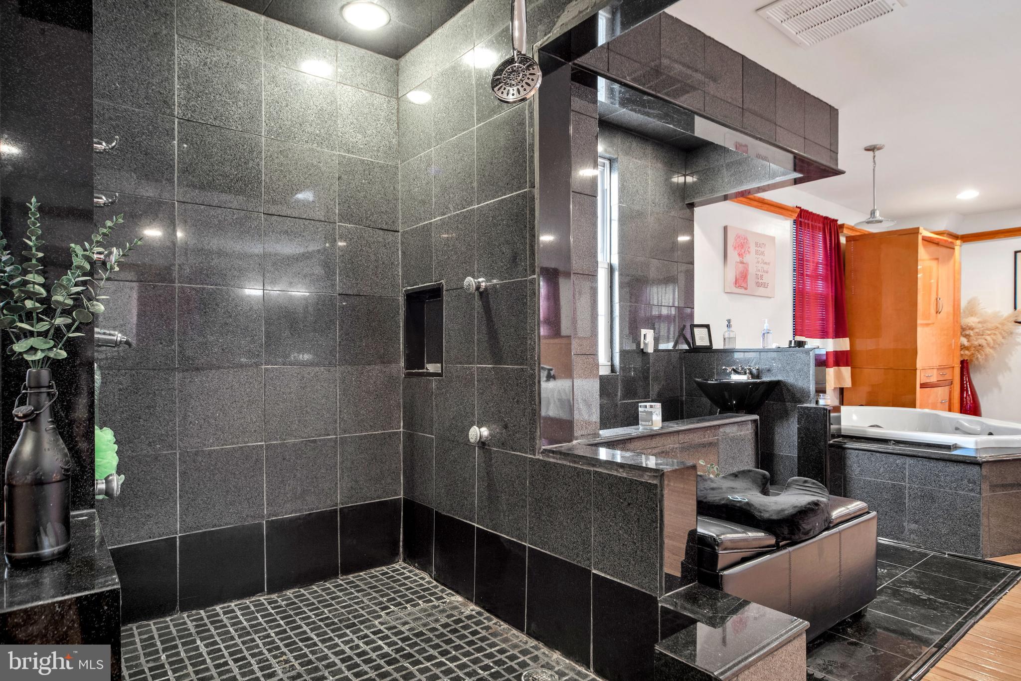 817 Ashbourne Road Cheltenham, PA 19012 - Photo 24 of 38 a bathroom with a sink a toilet and shower