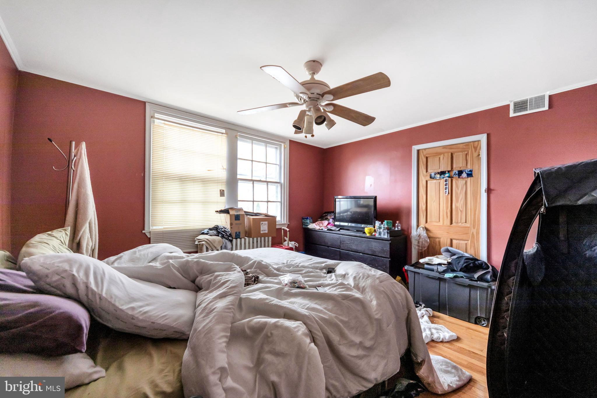 817 Ashbourne Road Cheltenham, PA 19012 - Photo 25 of 38 a bedroom with a bed and window