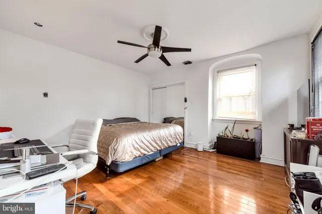 a bedroom with bed and window