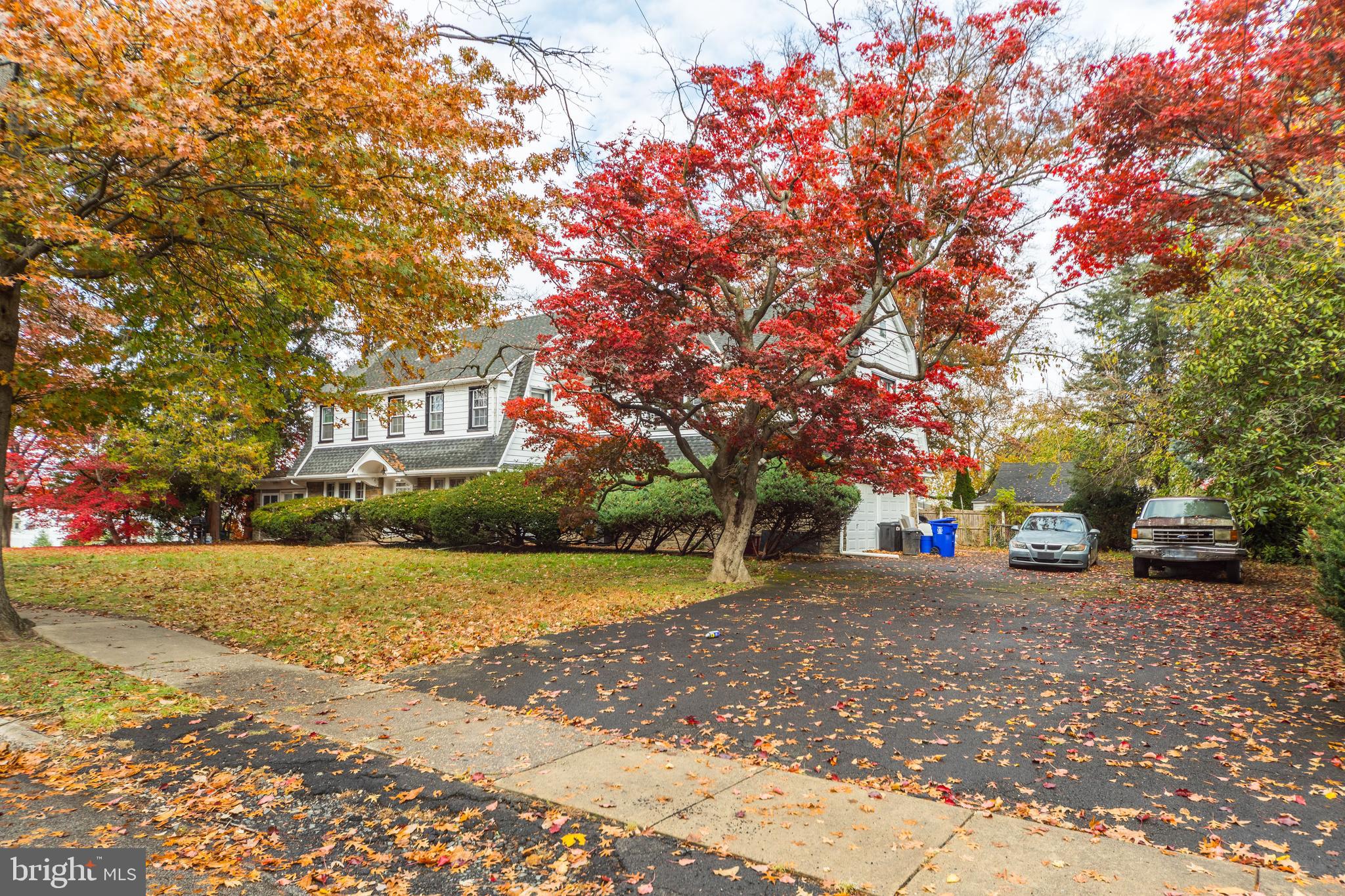 817 Ashbourne Road Cheltenham, PA 19012 - Photo 4 of 38 a view of a house with a yard and sitting area