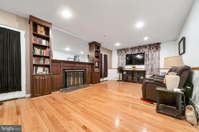 a view of a kitchen with workspace and wooden floor