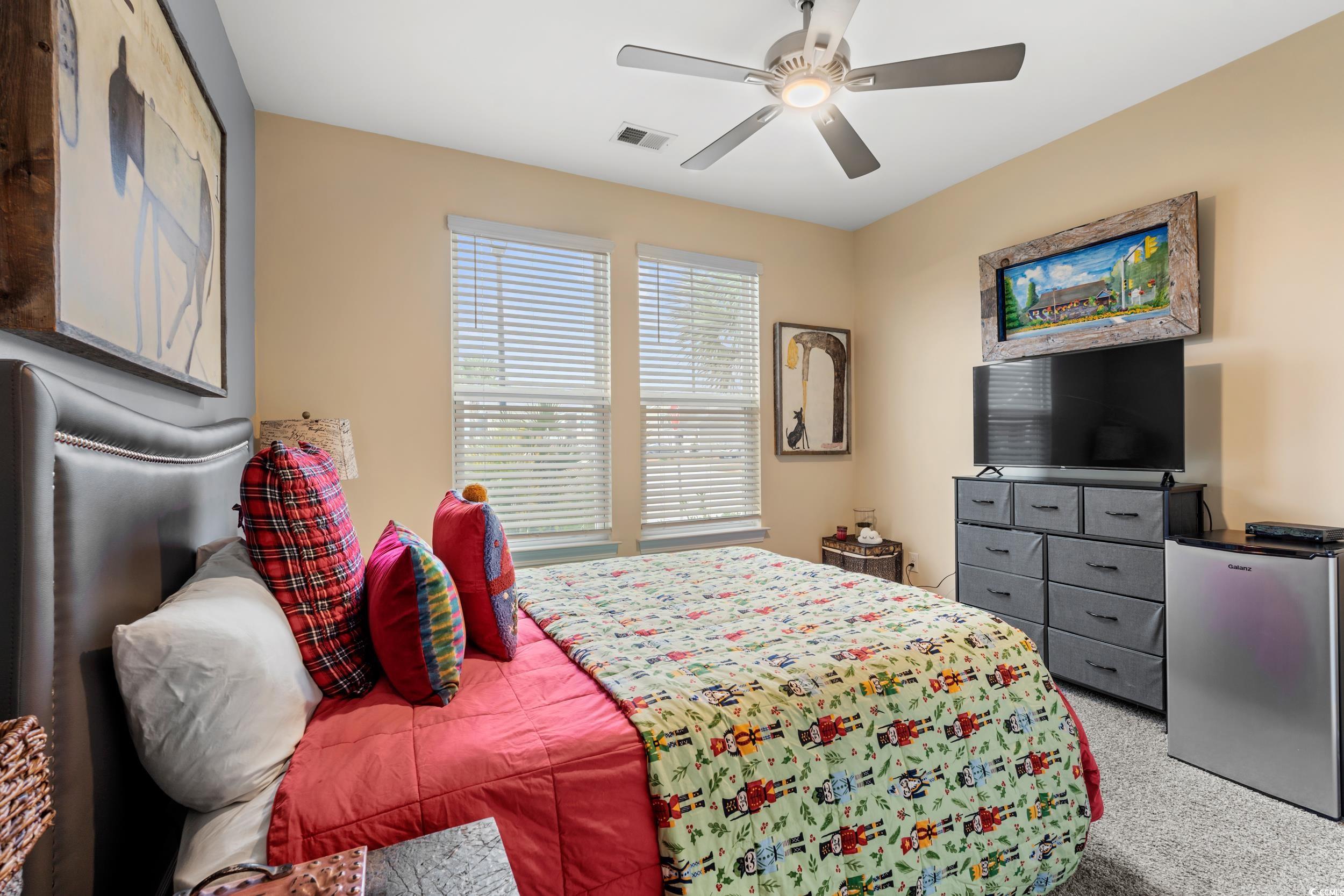 259 Switchgrass Loop Little River, SC 29566 - Photo 18 of 31 Bedroom #3. Carpeted bedroom with ceiling fan and spacious closet.