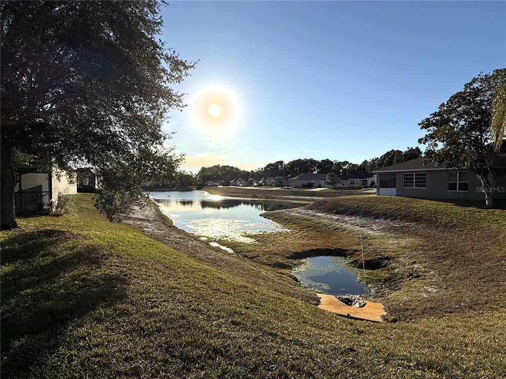 10127 Tria Drive Weeki Wachee, FL 34613 - Photo 24 of 33 a view of a lake with houses