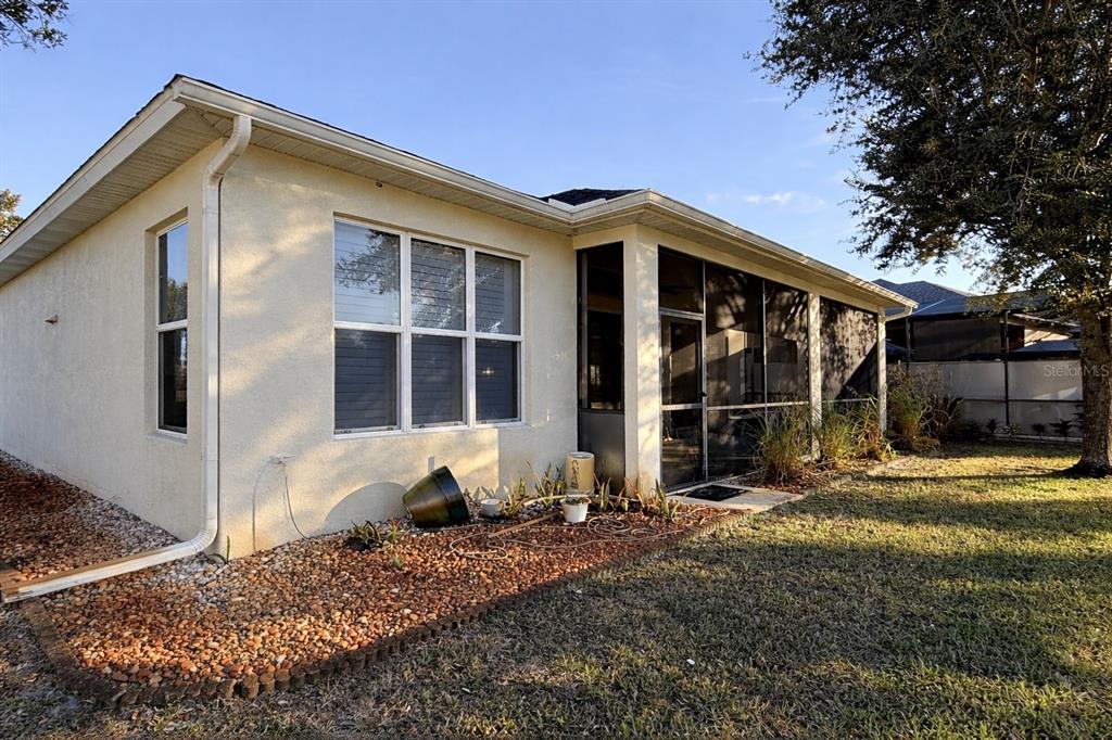 10127 Tria Drive Weeki Wachee, FL 34613 - Photo 5 of 33 a front view of a house with garden