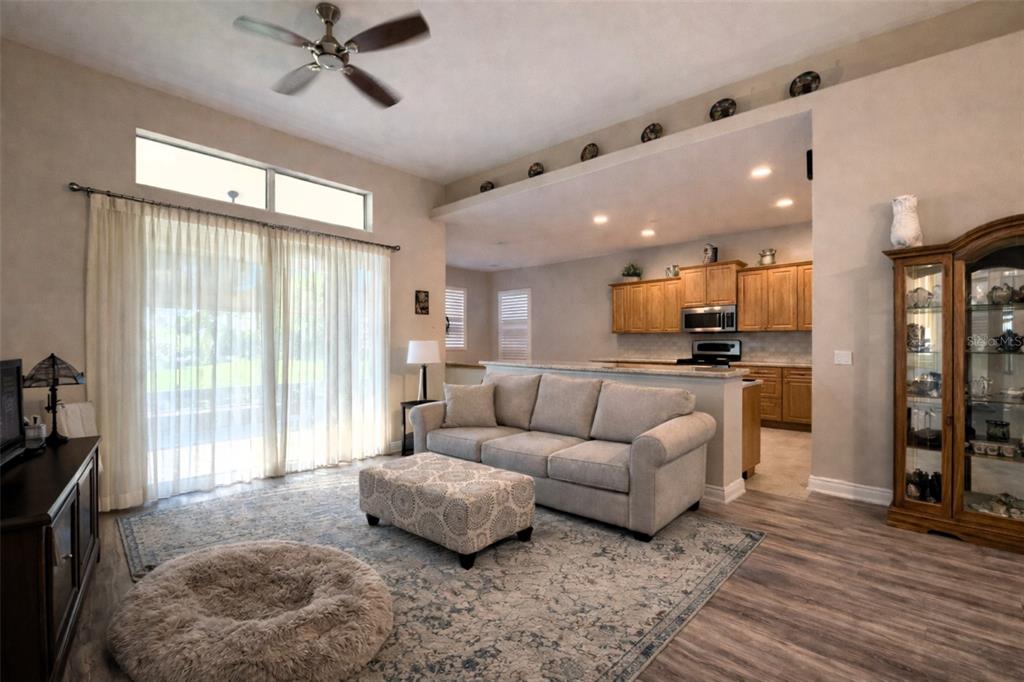 10127 Tria Drive Weeki Wachee, FL 34613 - Photo 7 of 33 a living room with furniture and a large window