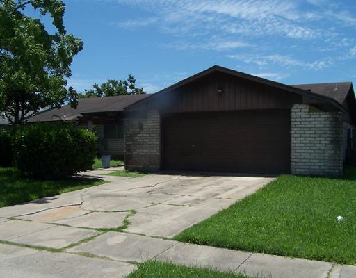 a house with trees in the background