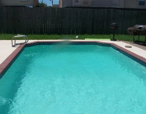 a view of swimming pool having patio