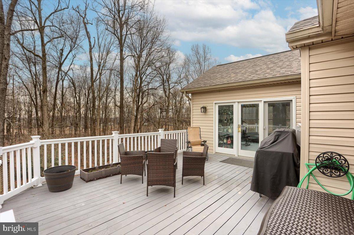 7666 Hickory Road Stewartstown, PA 17363 - Photo 51 of 57 Large composite deck leading out from sunroom