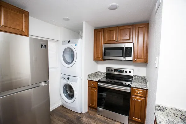 a kitchen with a stove and a microwave