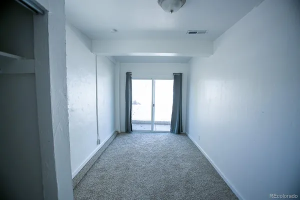 a view of hallway with closet