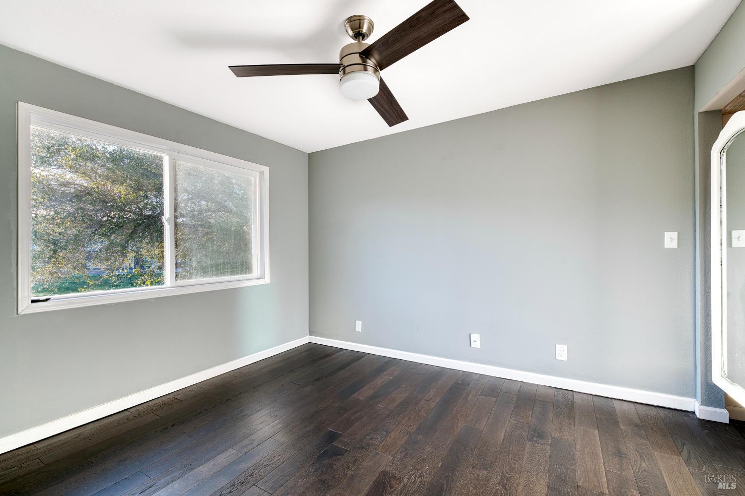 1534 Buchanan Street Novato, CA 94947 - Photo 19 of 30 a view of a room with wooden floor and a window