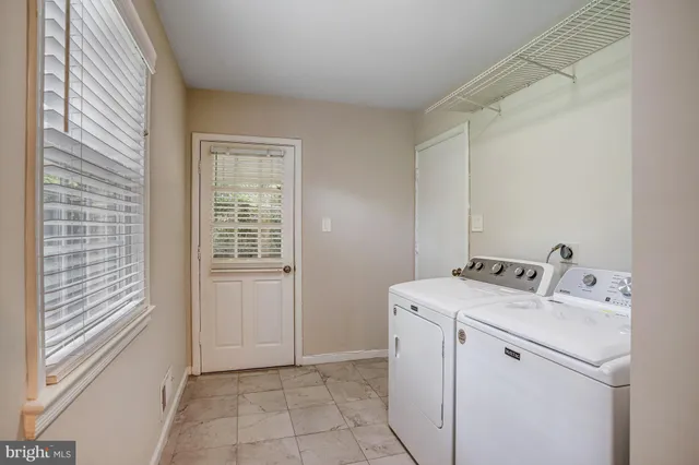 a bathroom with a sink mirror toilet and shower
