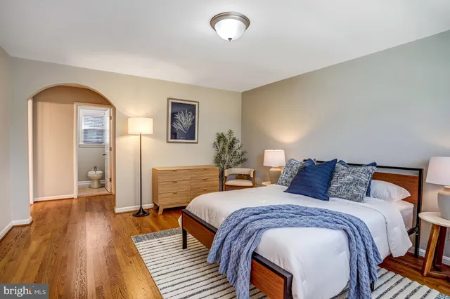 a bathroom with a double vanity sink toilet and mirror