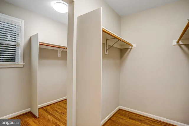 a view of a brick building next to a yard