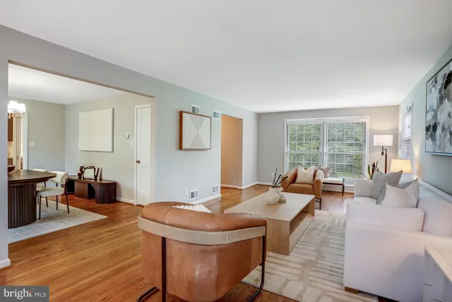 a kitchen with stainless steel appliances granite countertop wooden cabinets a stove top oven a sink and dishwasher