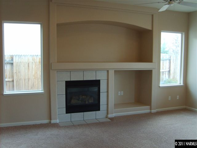 2440 Baton Drive Reno, NV 89521 - Photo 2 of 13 a living room with a fireplace in it