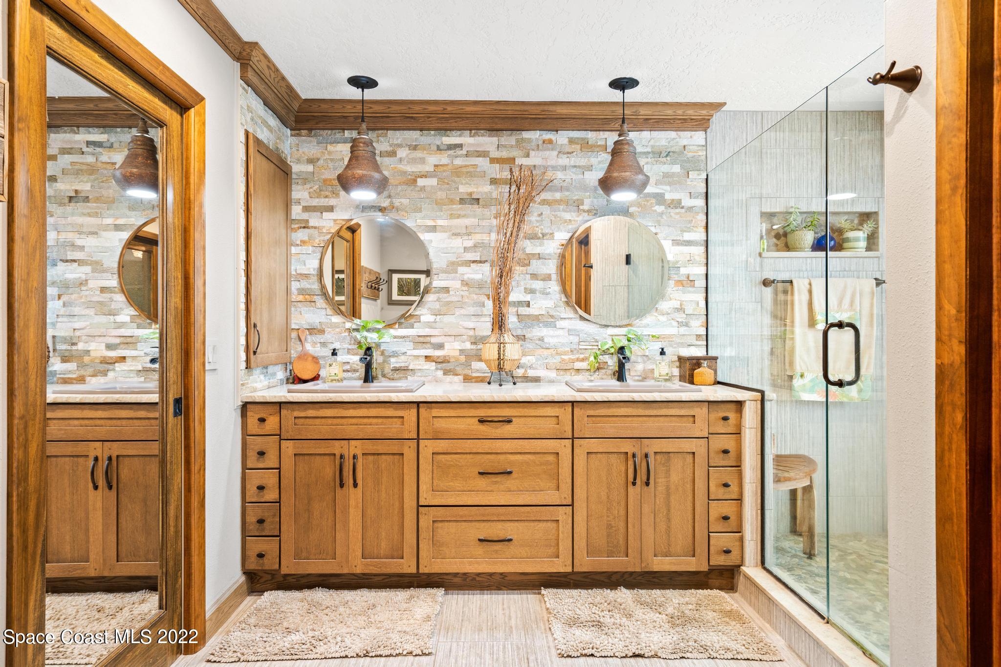14 Country Club Road Cocoa Beach, FL 32931 - Photo 24 of 64 a bathroom with a granite countertop sink and a mirror