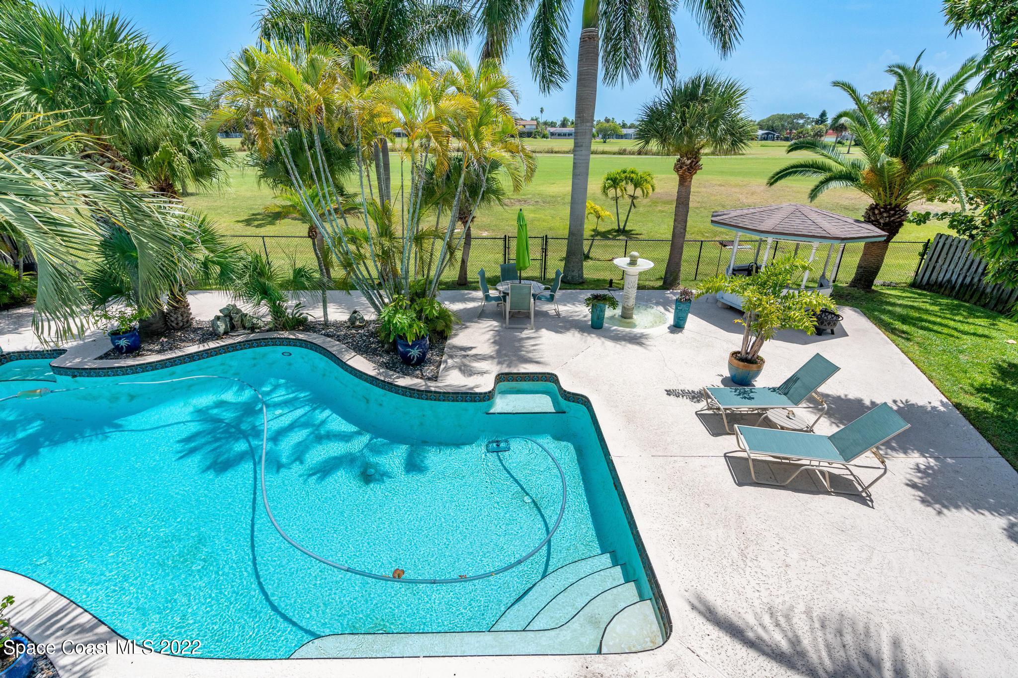 14 Country Club Road Cocoa Beach, FL 32931 - Photo 43 of 64 a view of swimming pool