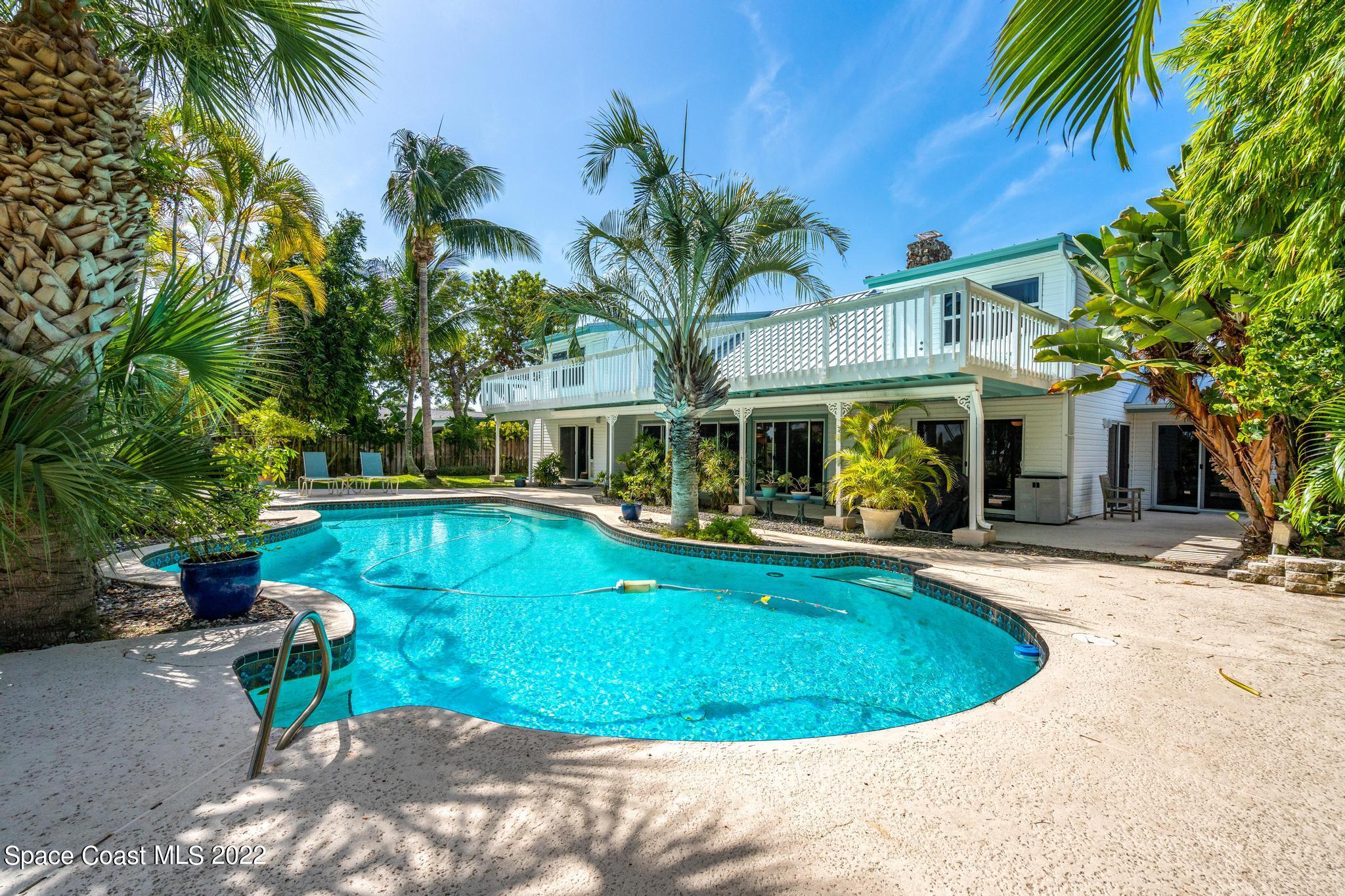 14 Country Club Road Cocoa Beach, FL 32931 - Photo 50 of 64 a view of a house with swimming pool and sitting area