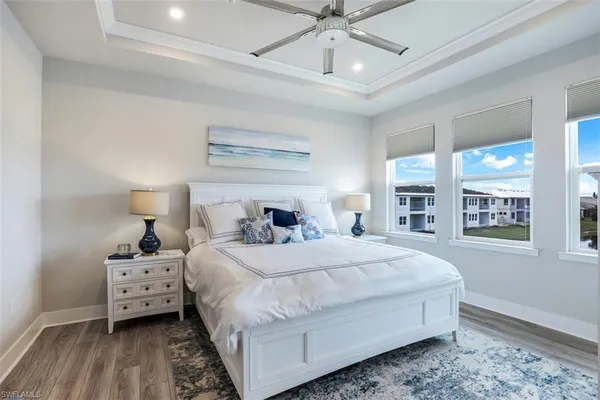 a bedroom with a large bed and a large window