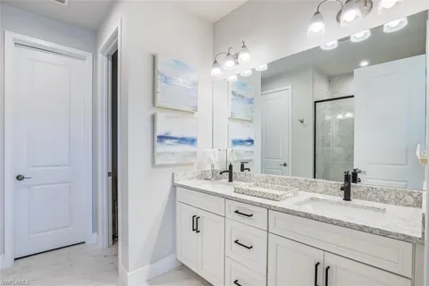 a bathroom with a glass shower door