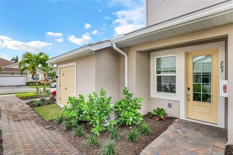 a view of house with yard and green space