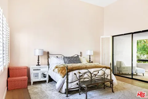 a bedroom with a bed and a couch