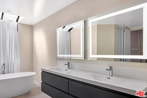 a view of a workspace with furniture and cabinet in a room