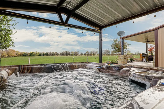 a view of a patio with a table chairs and a patio