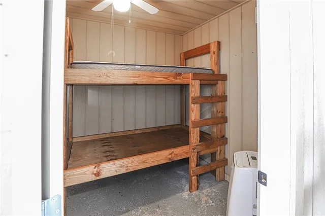 a bathroom with a granite countertop toilet a sink and a shower