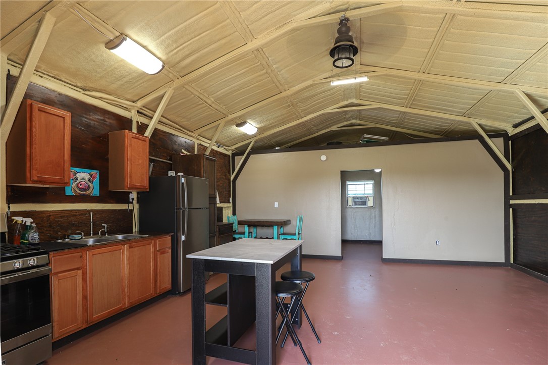 291 Lcr 644 Thornton, TX 76687 - Photo 37 of 51 a kitchen with refrigerator and chairs
