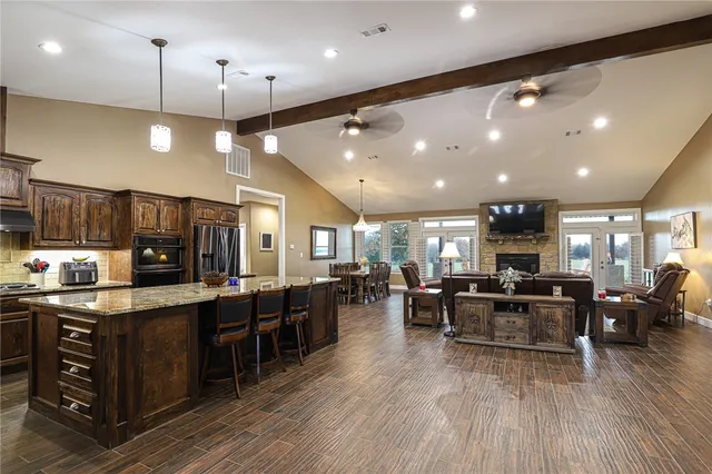 a kitchen with lots of counter space dining table and chairs