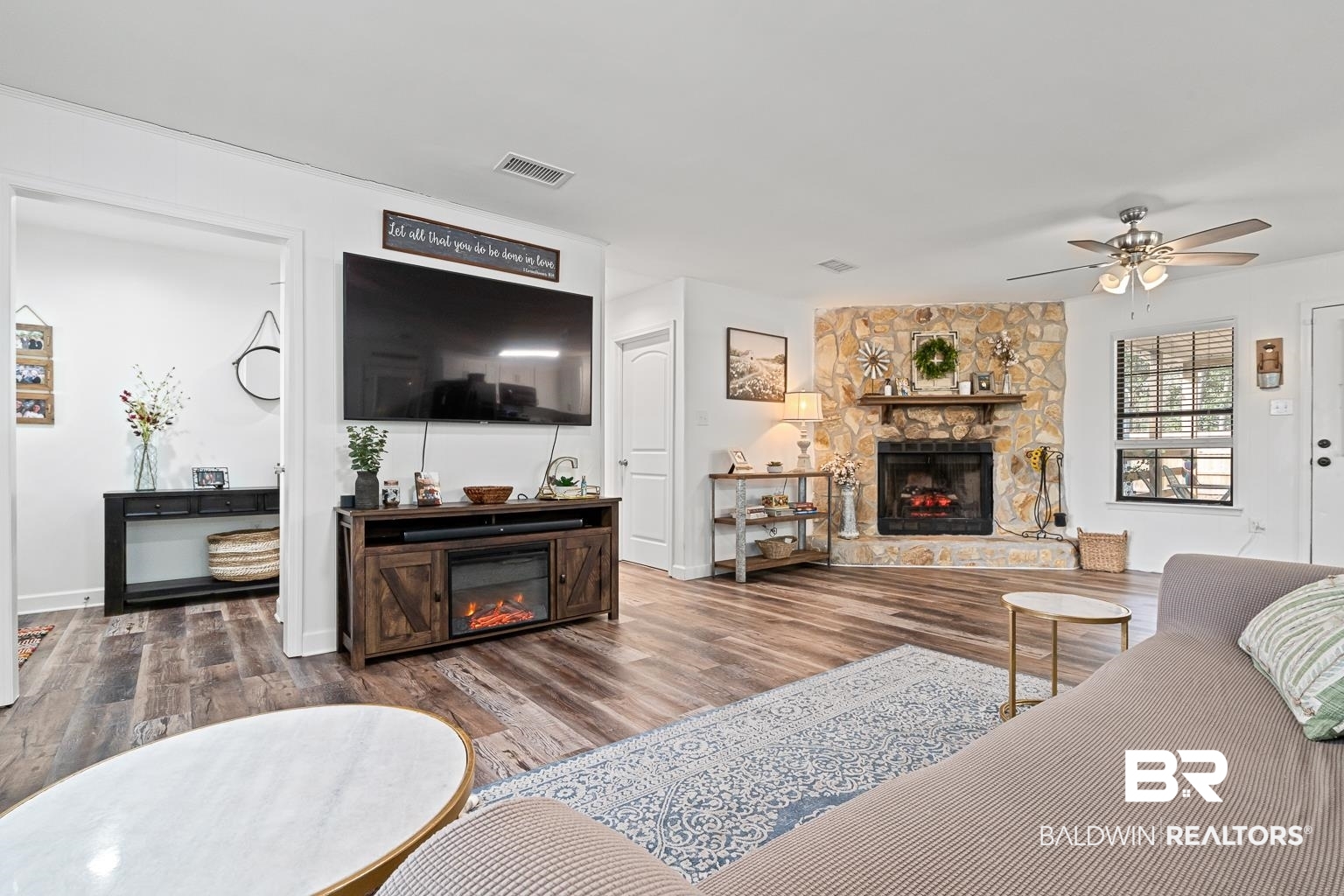 6801 Piney Woods Road Foley, AL 36535 - Photo 23 of 74 Living room featuring a fireplace, a ceiling fan, and dark wood finished floors