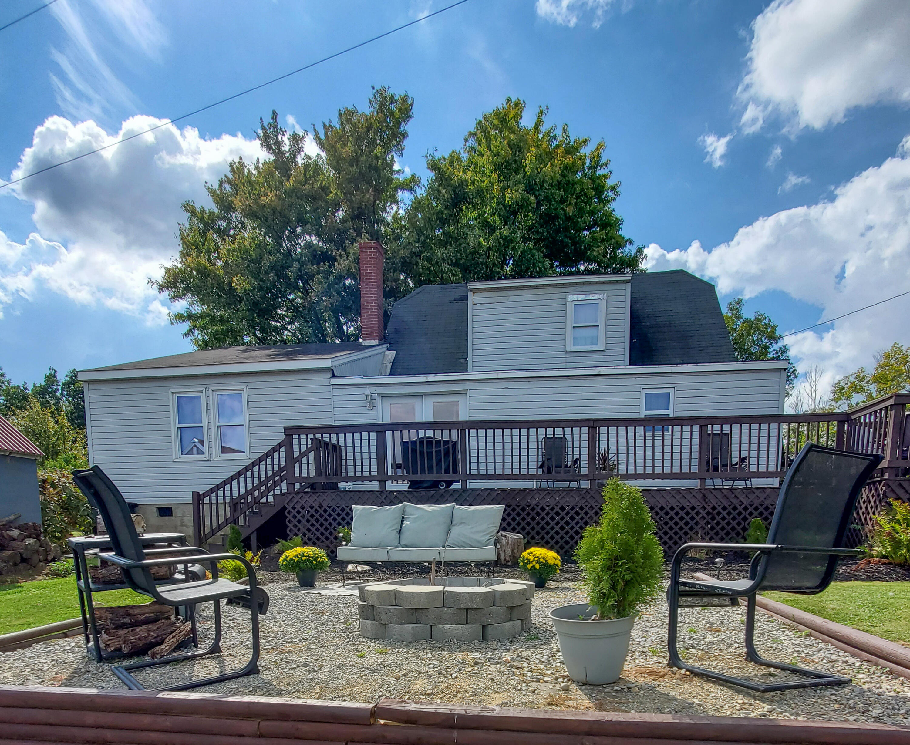 2663 Bethlehem Church Road Northeast Pilot, VA 24138 - Photo 2 of 24 a view of a patio with couches chairs and a potted plant