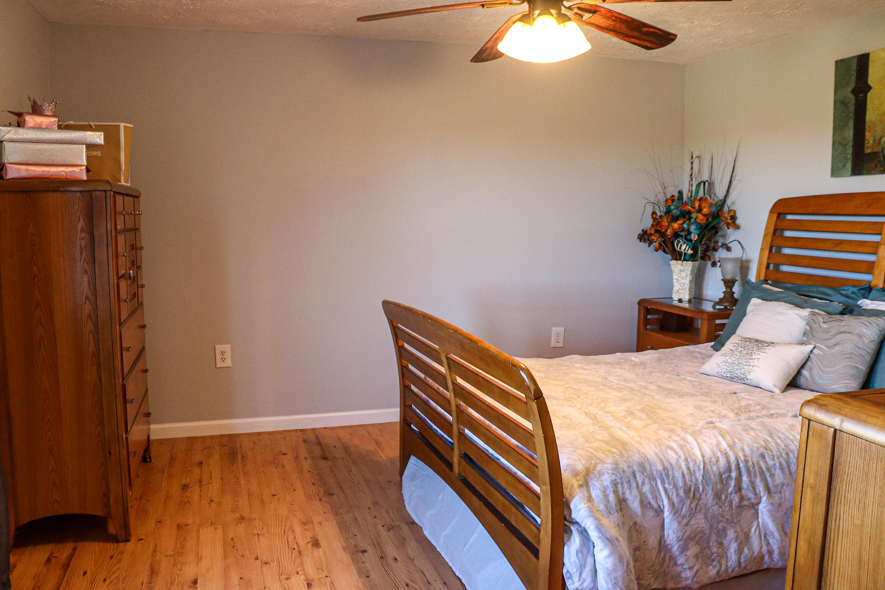 2663 Bethlehem Church Road Northeast Pilot, VA 24138 - Photo 15 of 24 a bedroom with a bed and a chandelier
