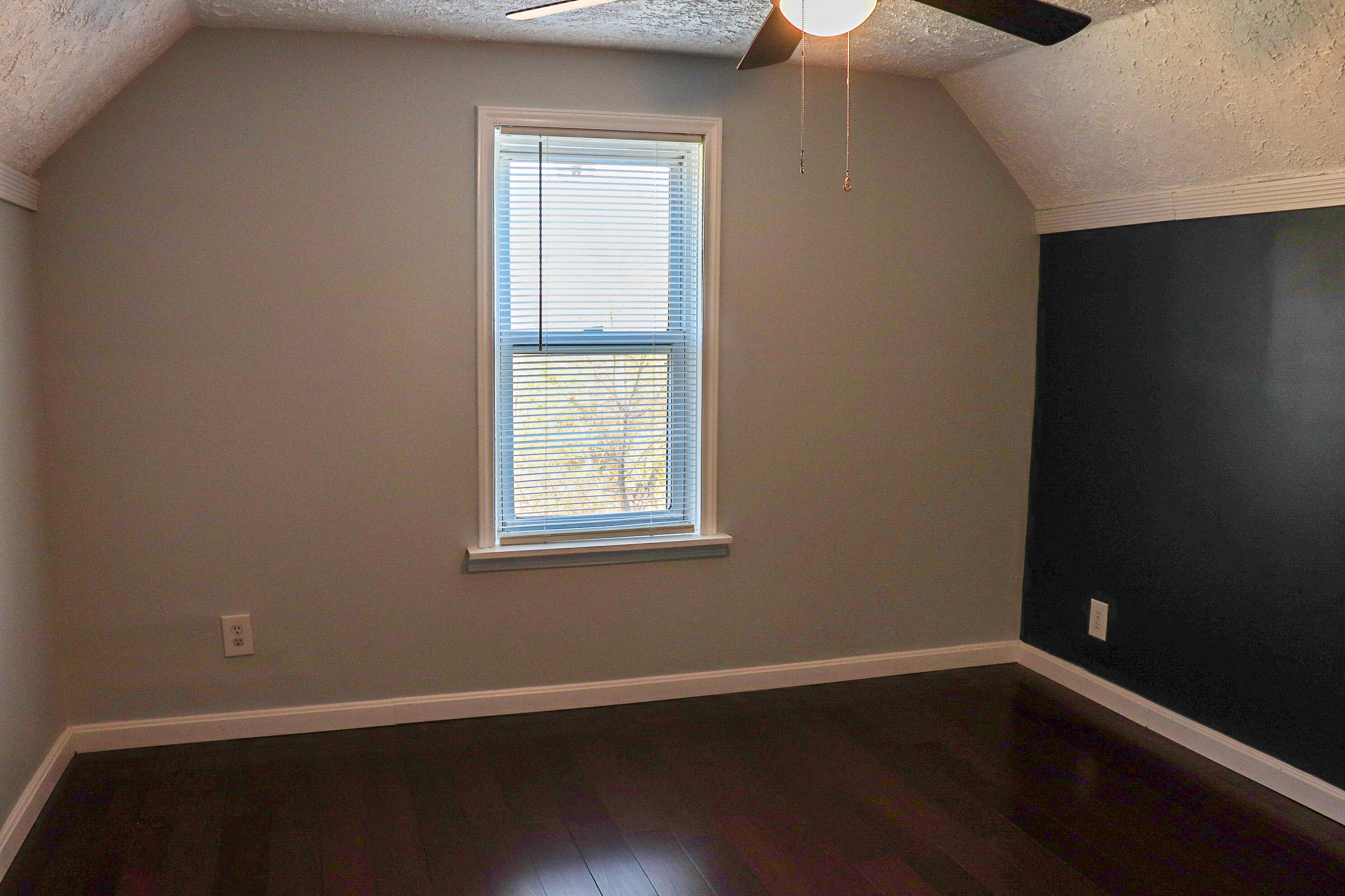 2663 Bethlehem Church Road Northeast Pilot, VA 24138 - Photo 18 of 24 a view of an empty room with wooden floor and a window