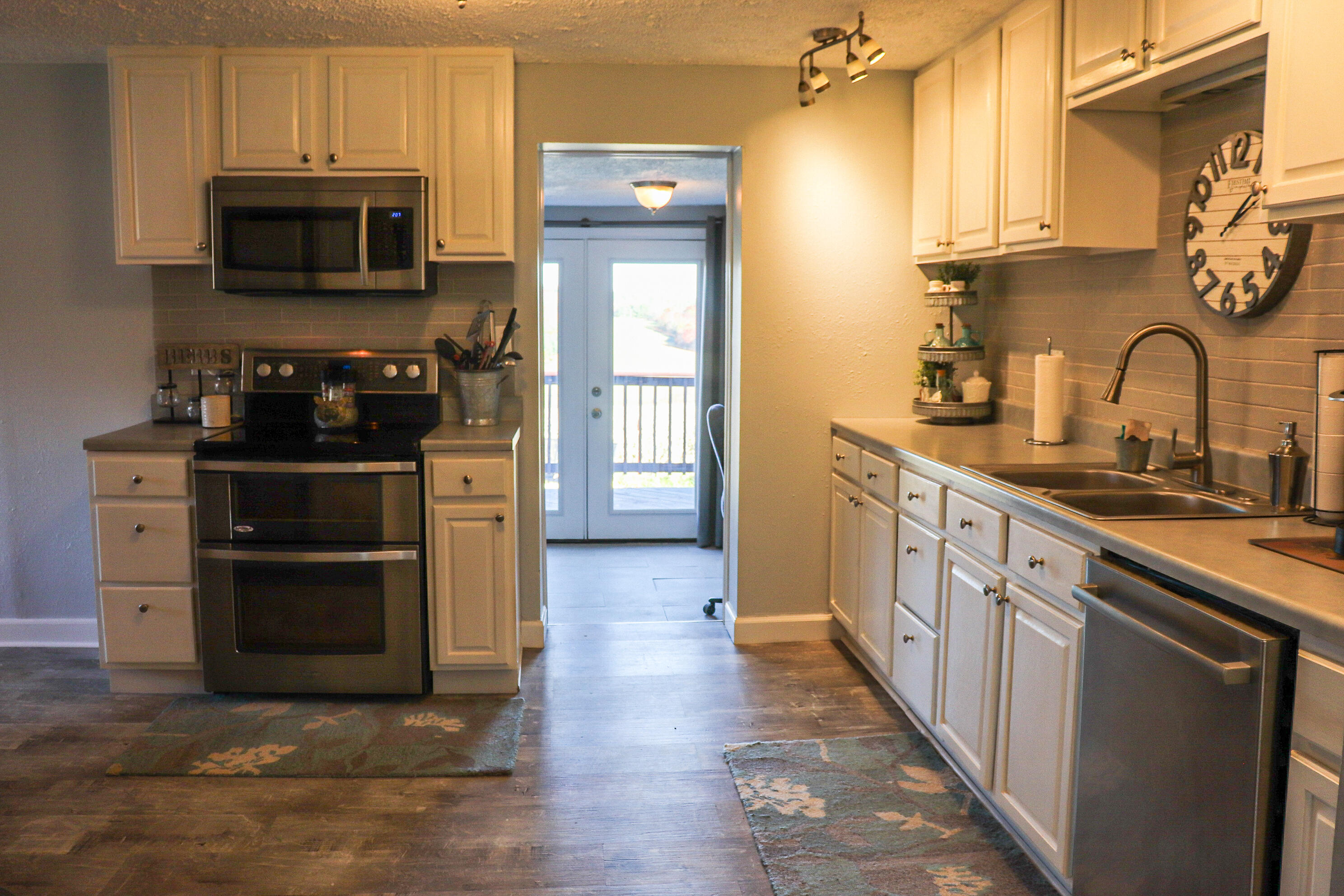 2663 Bethlehem Church Road Northeast Pilot, VA 24138 - Photo 5 of 24 a kitchen with stainless steel appliances a stove a sink and a microwave