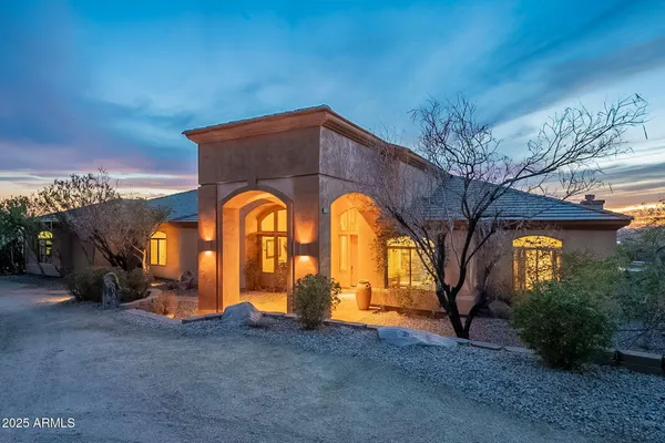 a view of house with outdoor space and mountain view
