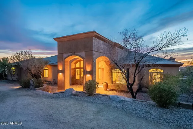 a view of house with outdoor space and mountain view