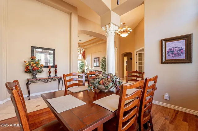 a bathroom with a tub a sink and a large mirror