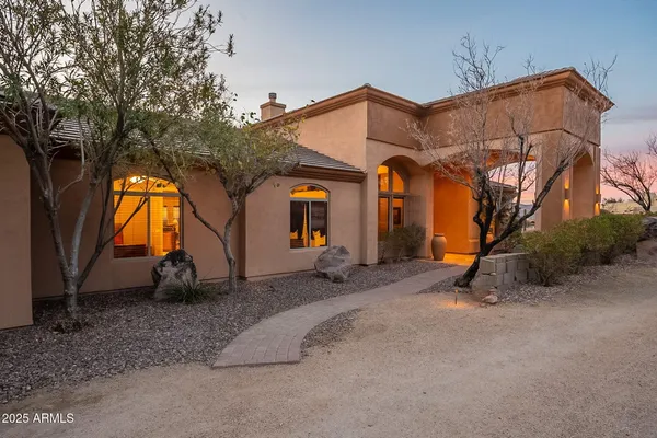 a view of entrance gate of a house