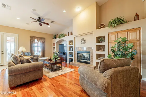 a living room with furniture and a large window