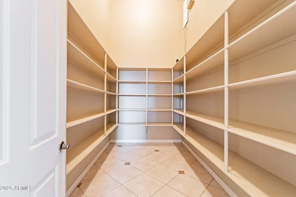 a view of a house with pool and a yard
